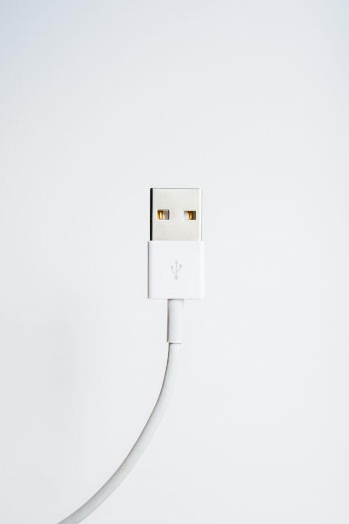 A white iPhone charging cable on a white background